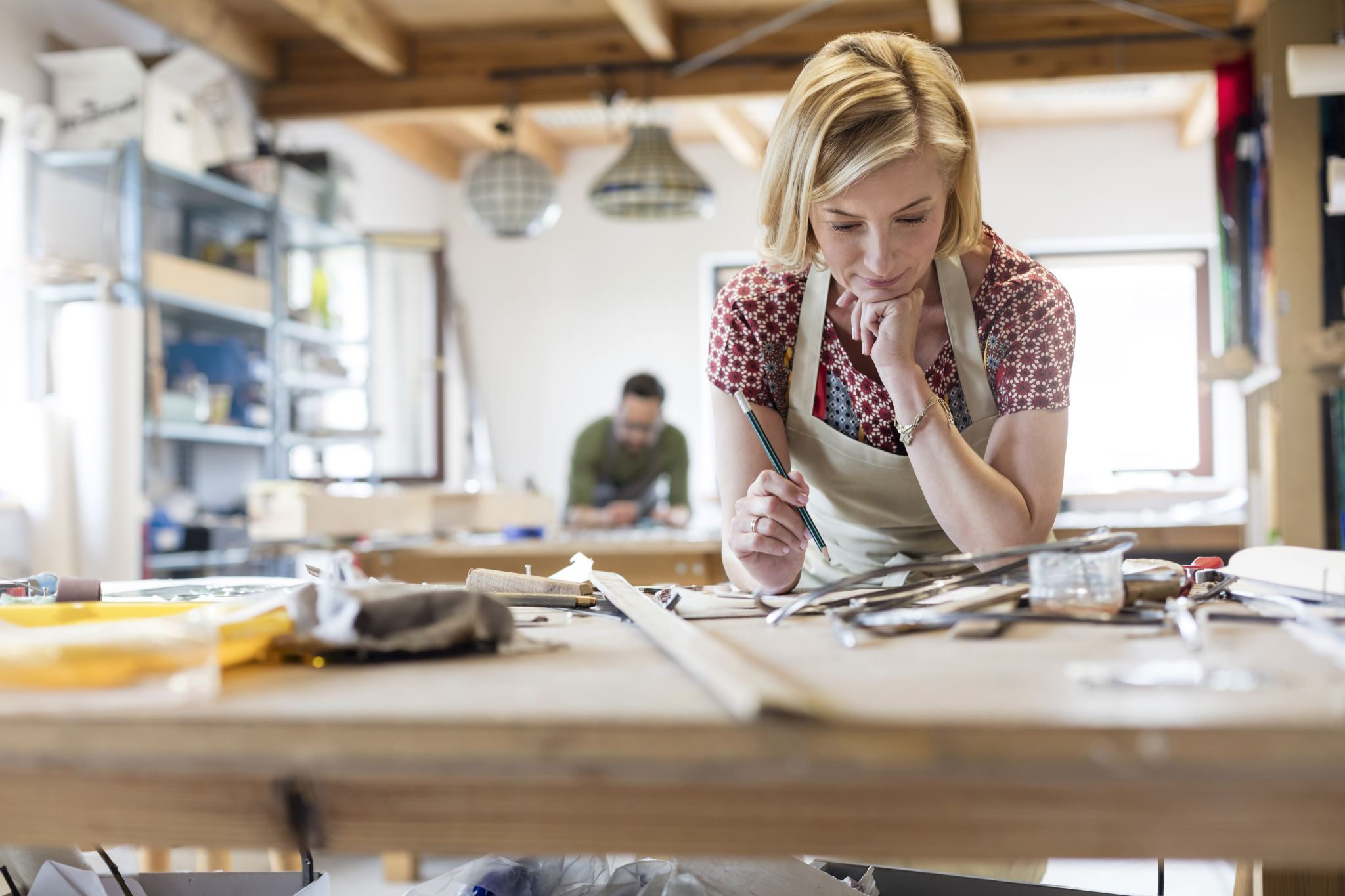 Stained-glass-artist-working-in-studio